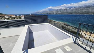 Thumbnail von Moderne Penthouses im obersten Stockwerk mit Dachterrasse und Pool direkt am Meer