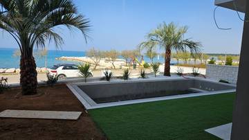 Thumbnail von Exklusive Erdgeschosswohnung mit Garten und Pool - 1. Reihe zum Meer