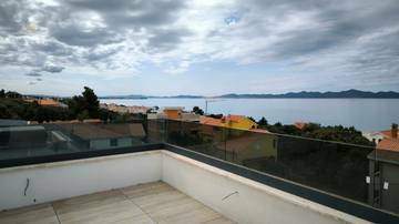 Thumbnail von Modernes Penthouse mit Dachterrasse und Panorama-Meerblick