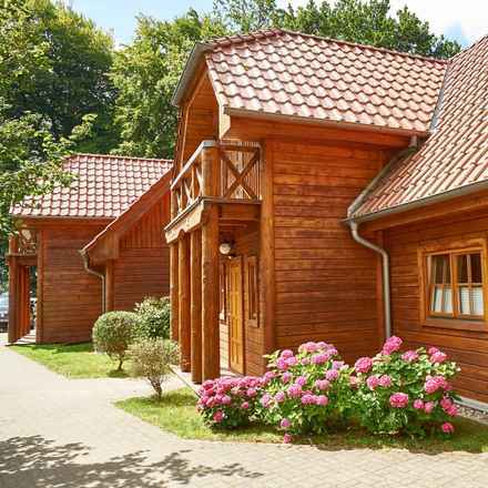 Holz trifft Hochufer: 4 strandnahe Wohneinheiten - Meeresrauschen gratis!