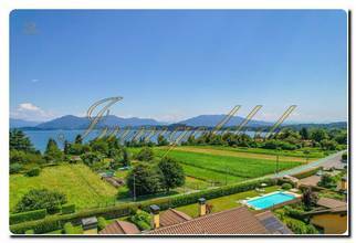 Thumbnail von Immogold Lago Maggiore, attraktive Maisonette in moderner Wohnanlage mit beeindruckendem Seeblick und exklusivem Gemeinschaftspool – ideal für alle, die Komfort, Ruhe und Lebensqualität schätzen.