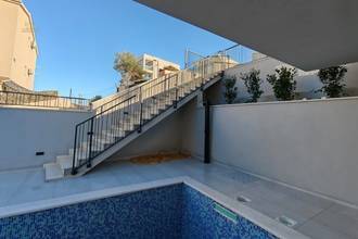 Thumbnail von Erdgeschosswohnung mit Pool, Garten und Meerblick