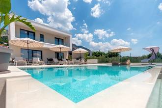 Thumbnail von Moderne Villa mit beheiztem Pool, Meerblick und Dachterrasse