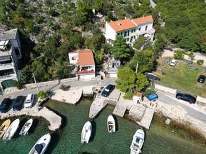Thumbnail von Doppelhaushälfte in erster Reihe zum Meer mit Bootsanleger (Nutzung), Garten und Garage