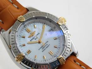 Thumbnail von Breitling Callisto Stahl Gold Medium 36mm mit original Perlmuttzifferblatt orangenes Lederband original Schließe