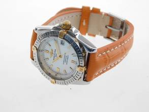 Thumbnail von Breitling Callisto Stahl Gold Medium 36mm mit original Perlmuttzifferblatt orangenes Lederband original Schließe