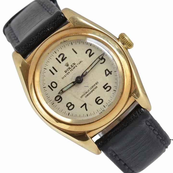 Rolex Oyster Perpetual 3131 BubbleBack Ivory radium dial yellow gold 14KT 1948's 