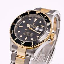 Thumbnail von Rolex Submariner Date 40 Stahl/Gold Schwarz – 16613 – wie NEU – 05/2006 Komplettset
